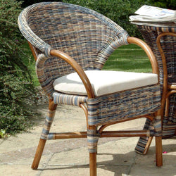 Small Cane Conservatory Chair Zebra Finish Conservatory Furniture Candle and Blue