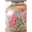 Decorative lamp with pink floral design on a beige background