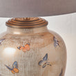 Decorative urn Jenny Worrall butterfly lamp with butterfly designs on a neutral background